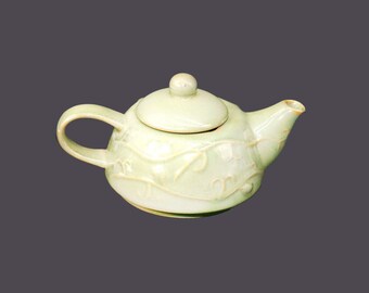 Pier 1 mini | tea-for-one | personal | small stoneware teapot. Raised leaves and berries, light green ground.