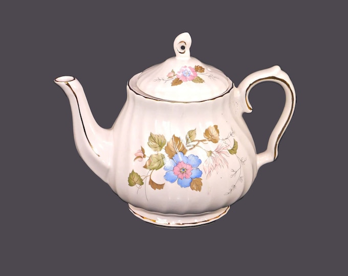 Sadler four-cup teapot. Windsor line. Blue flowers with pink centers, green and brown leaves, gold edge accents.