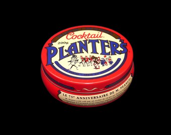 Planters Cocktail Peanuts bilingual round tin. 75th Birthday of Mr. Peanut.