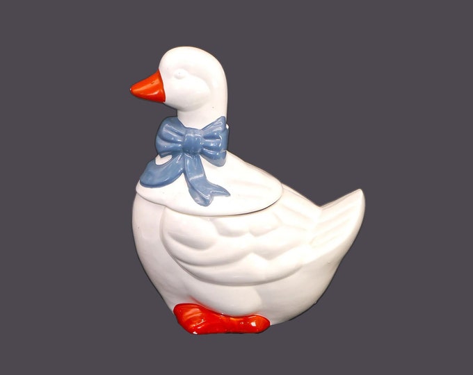 Duck cookie jar with blue bow. Matches with the Marmalade series. Made in Taiwan for Sophia Ann. Flaw (see below).