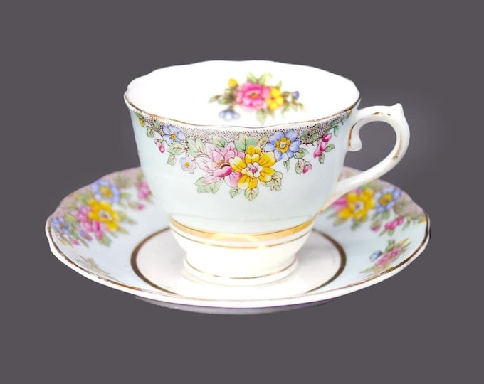 Colclough powder blue and florals bone china cup and saucer set made in England. Minor flaws (see below).
