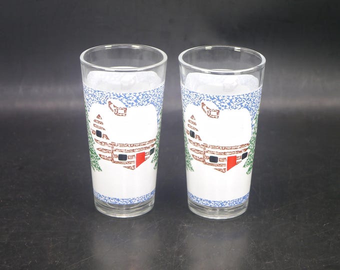 Pair of KIG Christmas Winter Scene Log Cabin in the Snow etched tumbler glasses. Christmas glassware made in Indonesia.