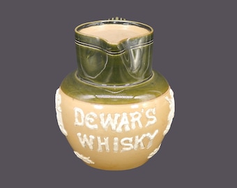 Antique Edwardian Age Royal Doulton salt-glazed pitcher advertising Dewars Scotch Whisky made in England.