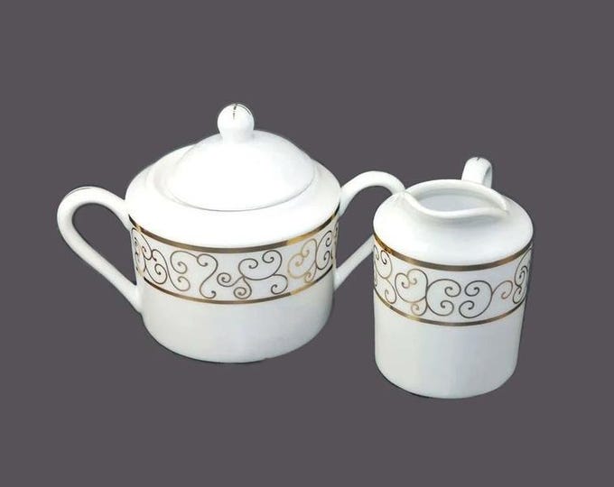 Holiday Joy Christmas creamer and covered sugar bowl set. Gold scrolls on white. Christmas tableware.
