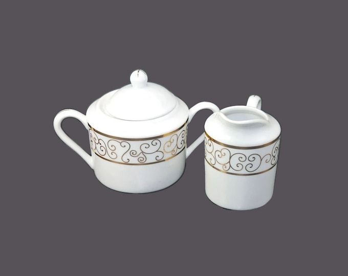 Holiday Joy Christmas creamer and covered sugar bowl set. Gold scrolls on white. Christmas tableware.