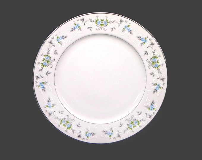 Sakura dinner plate. Blue roses, white embossed flowers, gray leaves and scrolls. Made in Japan. Sold individually.