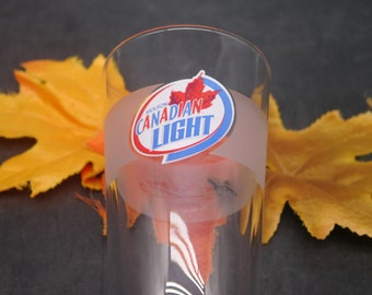 Molson Canadian Light pint glass. Etched-glass branding, frosted signature panel, weighted base. Libbey Duratuff made in USA.