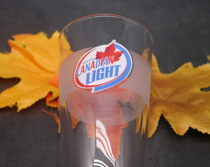 Molson Canadian Light pint glass. Etched-glass branding, frosted signature panel, weighted base. Libbey Duratuff made in USA.