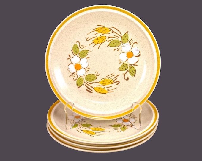 Four Hearthside Garden Festival Prairie Flowers stoneware salad plates made in Japan. Flaws (see below).