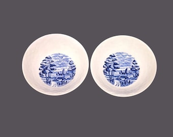 Pair of blue and white landscape coupe cereal bowls made in Japan. Flaw (see below).