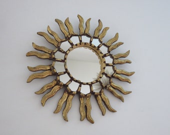 Antique French giltwood wall sunburst mirror with Art Deco baroque mirror inlays, circa 1930-1940.