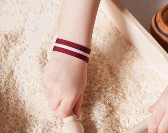 Latvian flag Bracelet red and white striped. Fabric Ribbon from latvia dark red flag color bracelet with a metal clasp