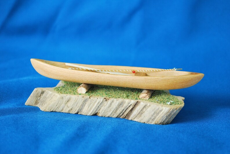 louisiana cypress dugout canoe with paddle and fishing