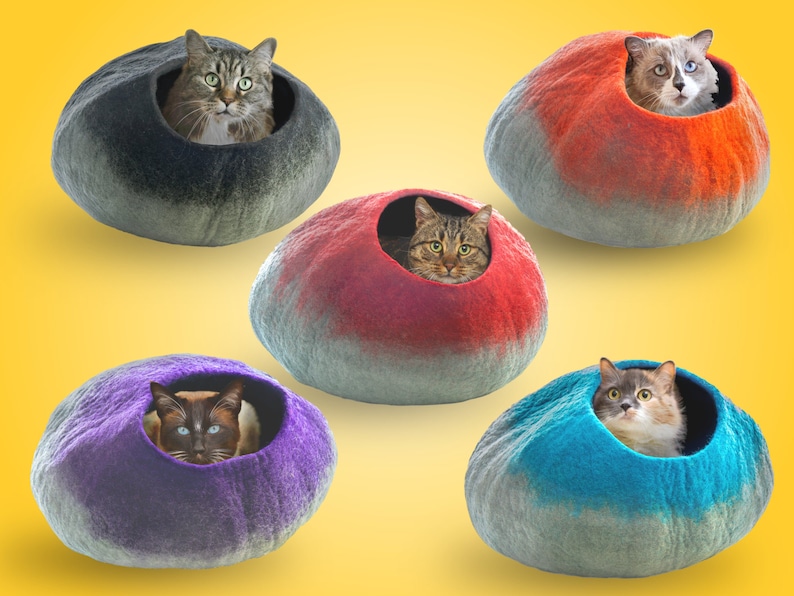 May include: Five felt cat beds in different colors, each with a cat inside. The beds are shaped like a half-sphere and have a hole for the cat to enter. The colors are gray, red, purple, blue, and a combination of red and gray.