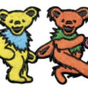 May include: Four colorful dancing bears in green, yellow, orange, and pink, each with a smiling face and a blue or green collar. The bears are holding hands and have a whimsical, cartoon-like design.