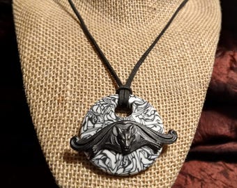 Swirling Bat Medallion: Bold Blackened Brass Bat on Clay Pendant, Gothic Vampire Bat on Marbleized Polymer Medallion, Black Leather Cord