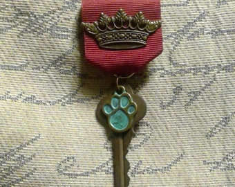 Paw Royale: Crown + Vintage Key with Pet / Paw Print Charm and Classical Crown on Burgundy Ribbon with Pin Backing