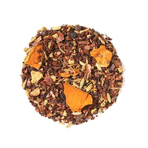 May include: A close-up of a blend of loose leaf tea with orange peel, spices, and herbs. The tea is a mix of brown, orange, and green pieces.