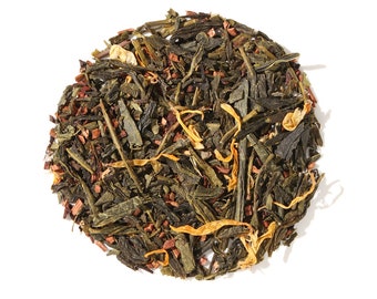 May include: A circular arrangement of loose leaf tea, featuring a mix of green tea leaves, reddish-brown pieces, and long, thin, yellow-orange petals. The tea is set against a clean white background, highlighting the natural colors and textures.