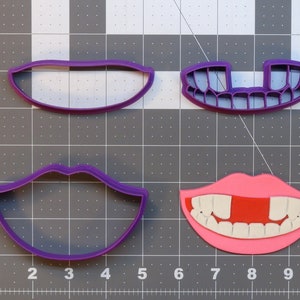 May include: Four purple plastic cookie cutters shaped like lips and teeth. Two cutters are closed lips, one is a set of teeth with a gap, and the last is a set of teeth with a gap and a pink lip outline.