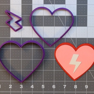 May include: Three purple cookie cutters in the shape of hearts, one with a lightning bolt inside. The lightning bolt is white and the heart is pink.