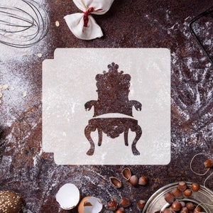 May include: A white stencil with a silhouette of a throne chair on a brown surface with flour and nuts.