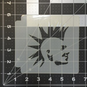 May include: A black and white stencil of a person with a mohawk hairstyle. The stencil is made of a clear plastic material and is approximately 6 inches wide.