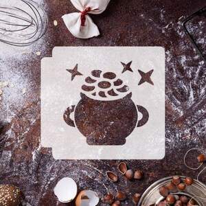 May include: White stencil with a black silhouette of a cauldron with stars above it. The cauldron is filled with coins. The stencil is on a brown surface covered in white flour.