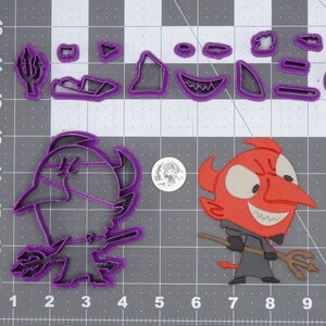 May include: Purple plastic cookie cutters in the shape of a devil, a trident, and other Halloween-themed shapes. The devil cookie cutter is holding a trident.