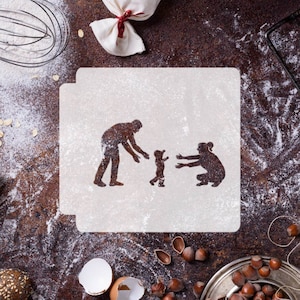 May include: A white stencil with the silhouette of a family of three: a father, a mother, and a child. The stencil is on a brown surface covered in white flour.