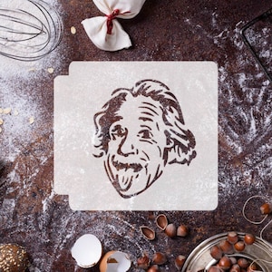 May include: A white stencil with a black silhouette of Albert Einstein sticking his tongue out. The stencil is on a brown surface with flour scattered around it.