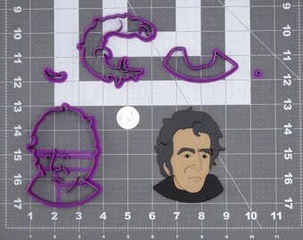 May include: A set of four purple plastic cookie cutters. The cutters are shaped like a man's face, a curved line, a small circle, and a curly design.