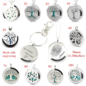 May include: Ten silver-toned aromatherapy diffuser necklaces with tree of life designs. The necklaces come in a variety of styles, including a key chain, a pendant with a fingerprint design, and a pendant with the text "my sunshine - love mom".