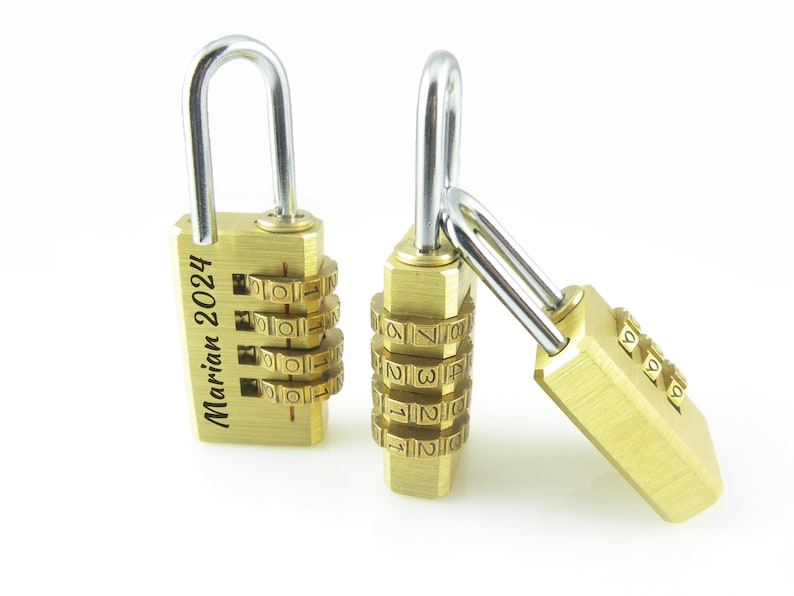 May include: Two gold combination locks with silver shackle loops. One lock has the inscription "Marian 2024" on the side.