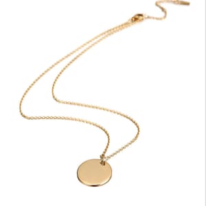 May include: A gold chain necklace with a round, plain gold pendant.