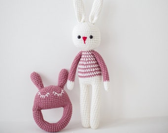 Stuffed easter bunny toy with a rattle. Plush striped handmade rabbit white with pink. Crochet toy for kids from Gebeya