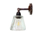 Brass sconce, Bronze finish diamond shaped glass shade. Adjustable wall lamp with a butterfly bolt.