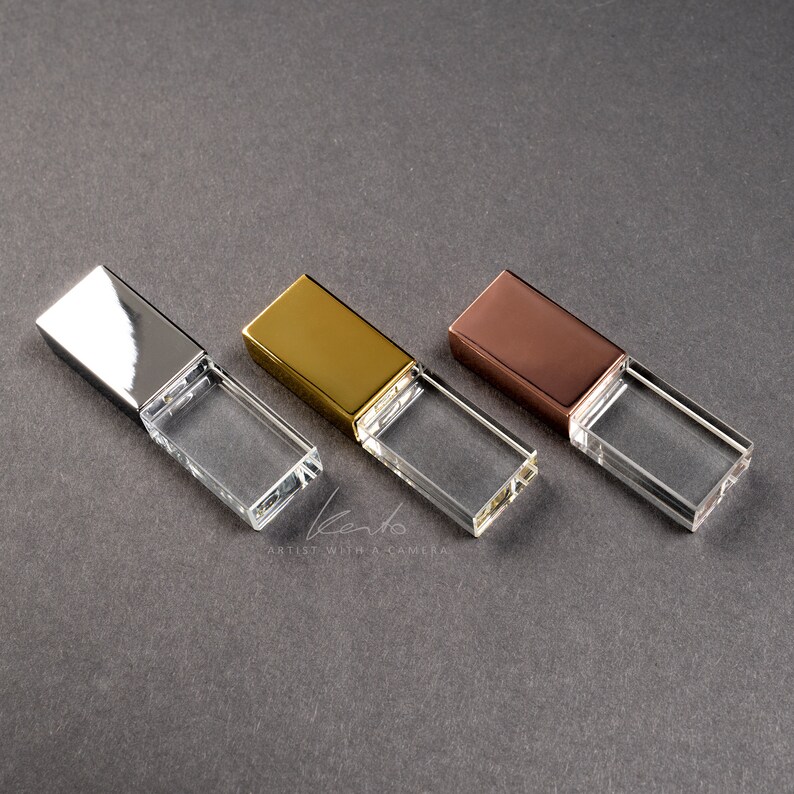 May include: Three crystal USB flash drives with different colored metal caps: silver, gold, and rose gold.