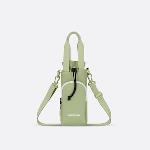 May include: A light green water bottle bag with a white accent pocket and a black drawstring closure. The bag has a handle and an adjustable shoulder strap. The brand name "SHERPANI" is printed on the front.