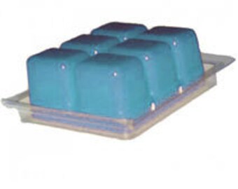 May include: A tray of six teal blue wax melts, ready to be used in a wax warmer.