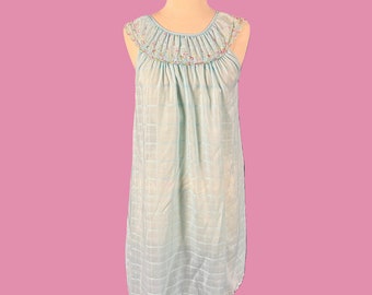 May include: A light blue sleeveless nightgown with a floral embroidered neckline and a checkered pattern.