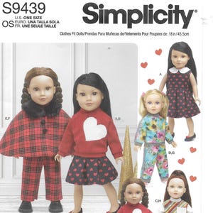 May include: Simplicity S9439 sewing pattern for 18-inch dolls. The pattern includes various outfits: a red plaid cape and pants, a red sweater with a white heart and a heart-print skirt, a floral print outfit, and a dress with a heart pattern.