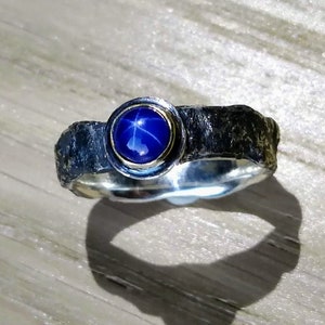 Star sapphire, gold and rough silver ring