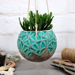 Turquoise ceramic hanging planter with hand carved geometric pattern | indoor or outdoor use | wall hanging planter | indoor plant hanger