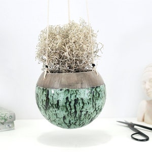 Large ceramic hanging planter with speckled green patterns | wall hanging planter | rustic wall decor | indoor or outdoor use | garden decor