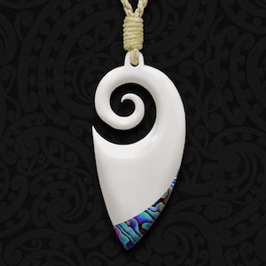 May include: White bone pendant with a spiral design and a blue and green abalone shell inlay. The pendant is attached to a brown cord.