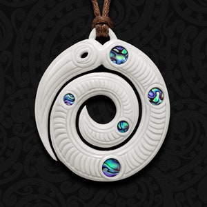 May include: White pendant with a spiral design and four iridescent abalone shell inlays. The pendant is on a brown cord.