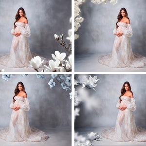 May include: A pregnant woman in a white, off-the-shoulder gown with floral print stands in front of a gray background with white flowers.