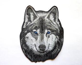 Machine embroidered wolf head patch