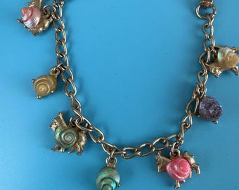 Pulsera vintage infantil con dijes de concha y animales de 6,25"